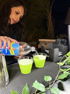 A bartender serving a drink.